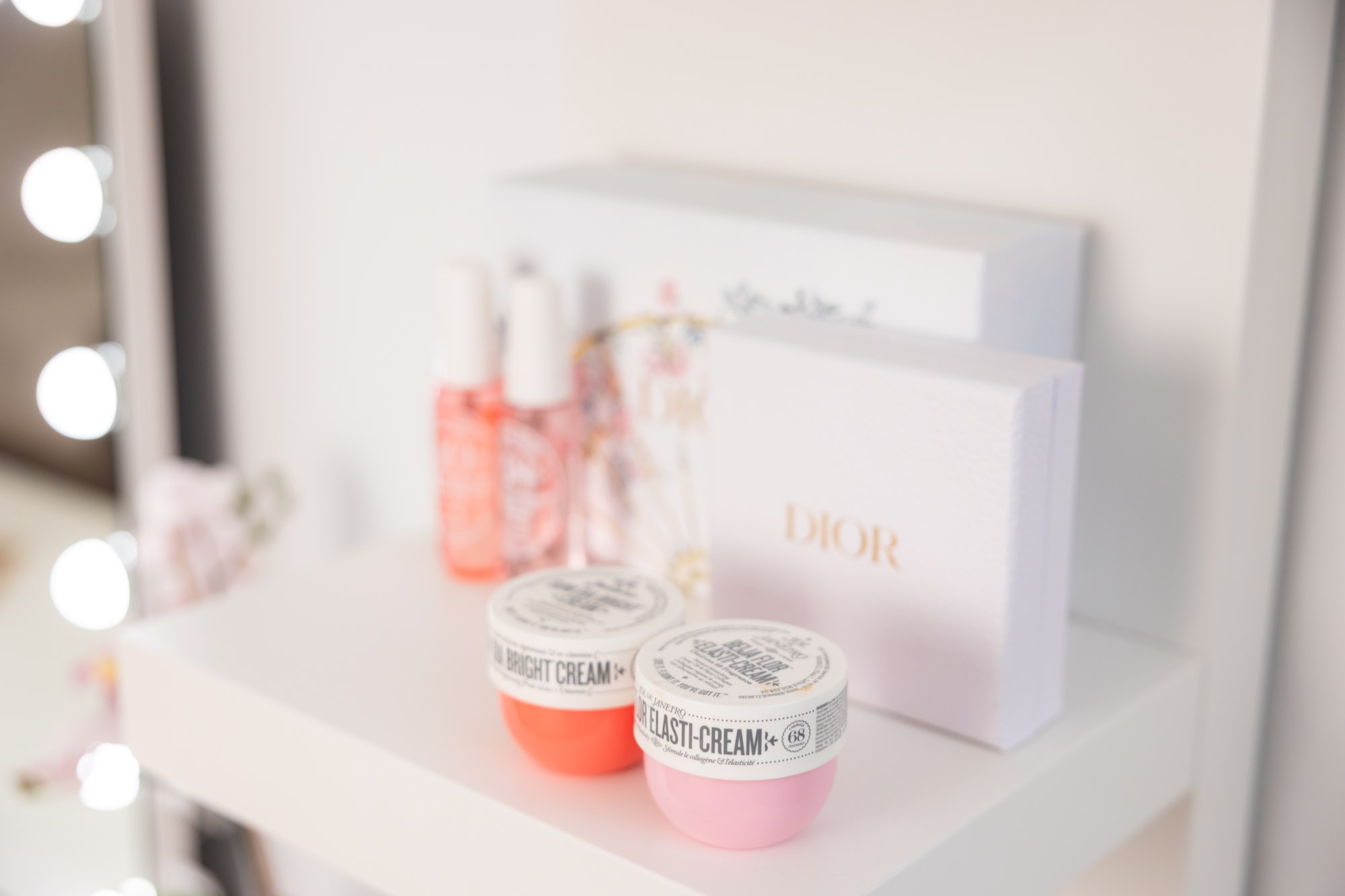 Skincare products displayed on vanity shelf