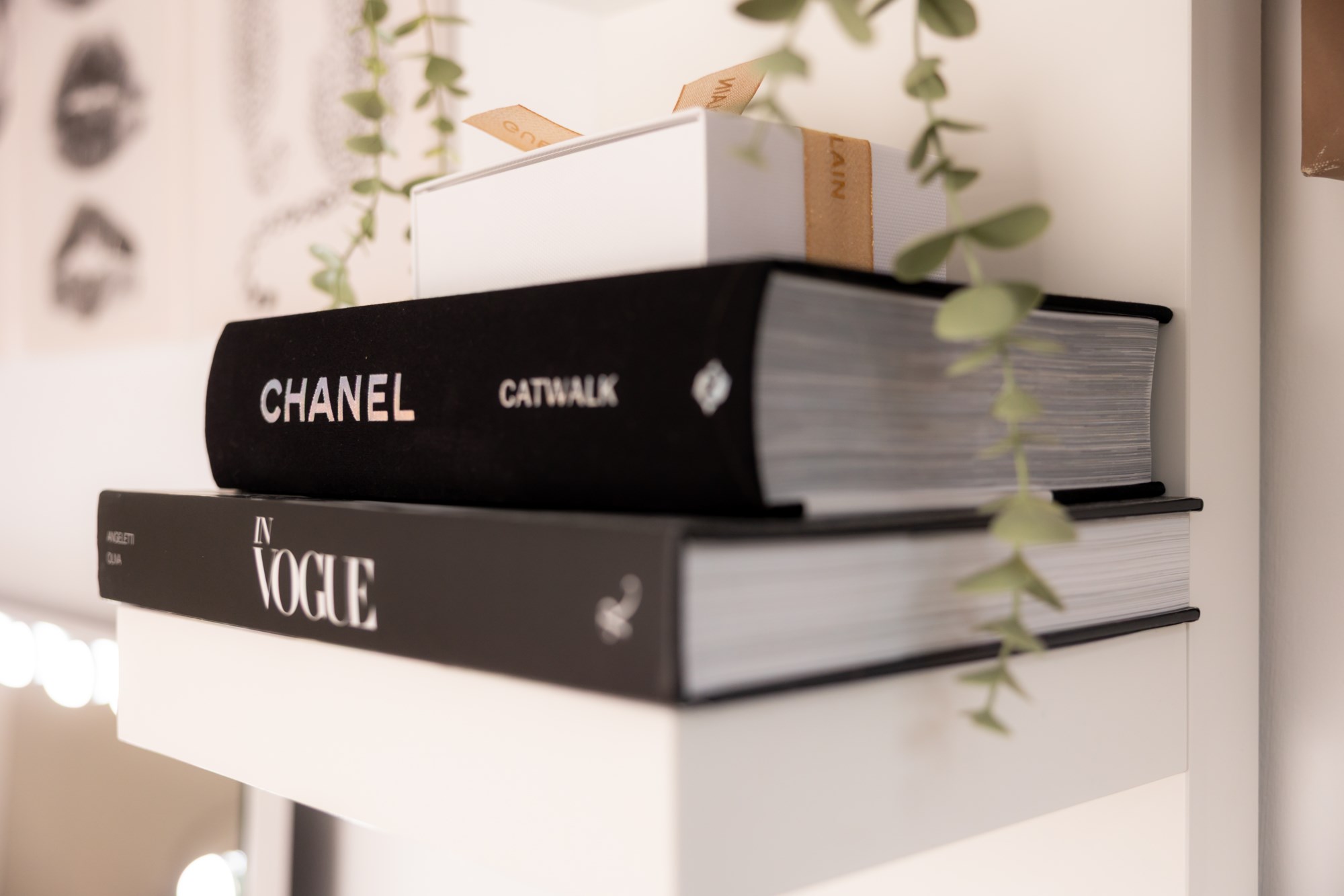 Styled shelf with fashion books and greenery
